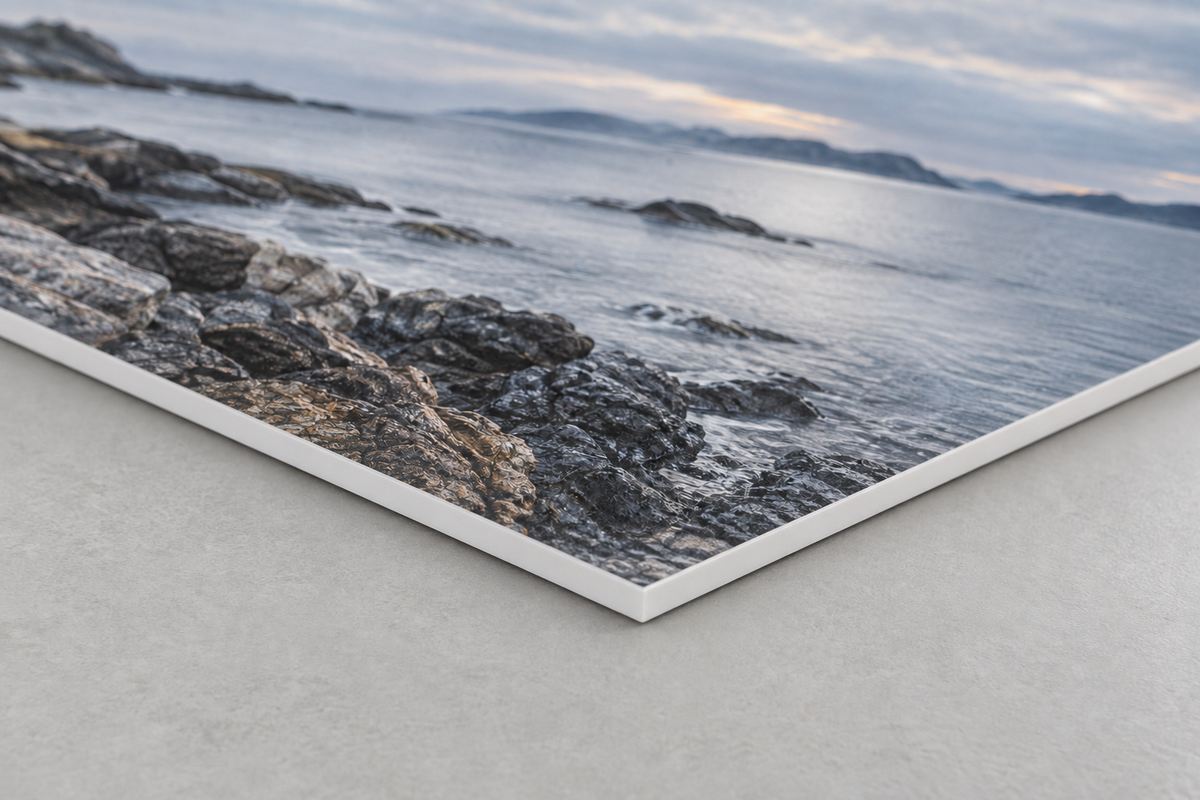 Construction illustration of a colour coastal print bonded to a thin white Sintra panel with a smooth, solid PVC edge.