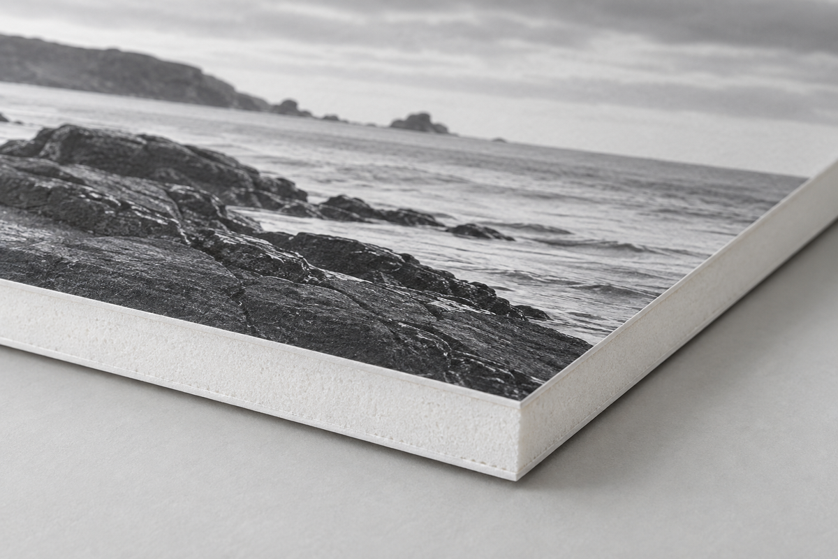 Construction illustration of a print bonded to white foamcore, showing the paper faces and foam centre.